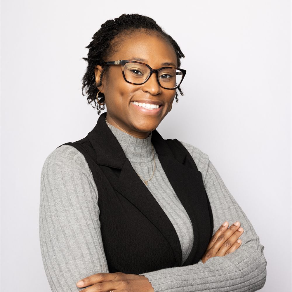 Tiirini Hill, PMHNP-BC, smiling with her arms crossed